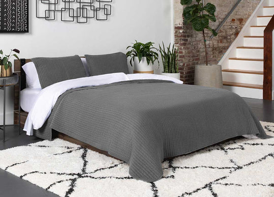 Arctic Quilt Set in charcoal on bed in bedroom environment #choose-your-color_charcoal