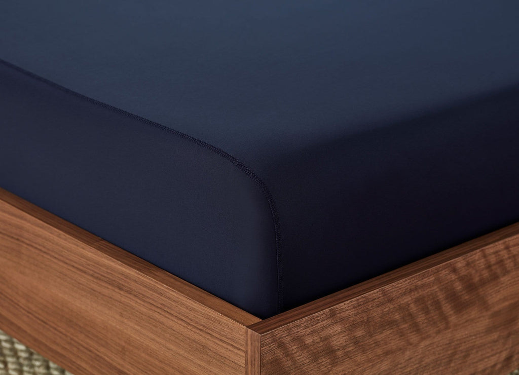 Original Performance Fitted Sheet on bed in Navy #choose-your-color_navy