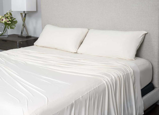 Active Comfort shown on bed in Parchment #choose-your-color_parchment