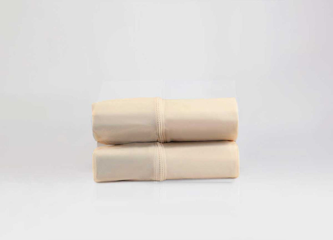 Active Comfort Pillowscases shown in Cream in stack #choose-your-color_cream