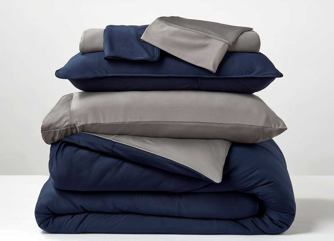 Studio Tech Bedding in navy and graphite in room environment #choose-your-color_navy-graphite